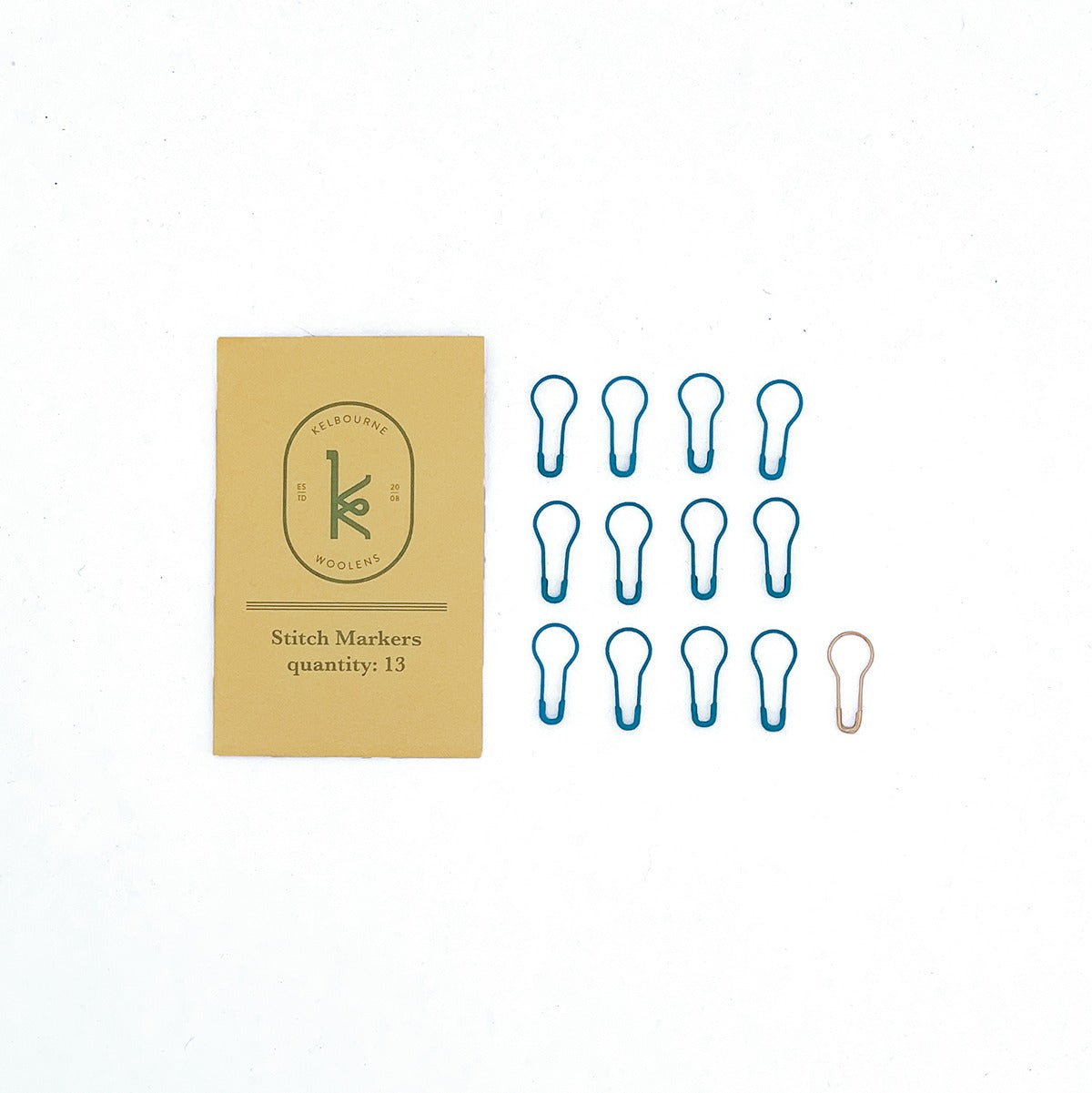 Kelbourne Woolens stitch markers and gold envelope packaging on a white background.